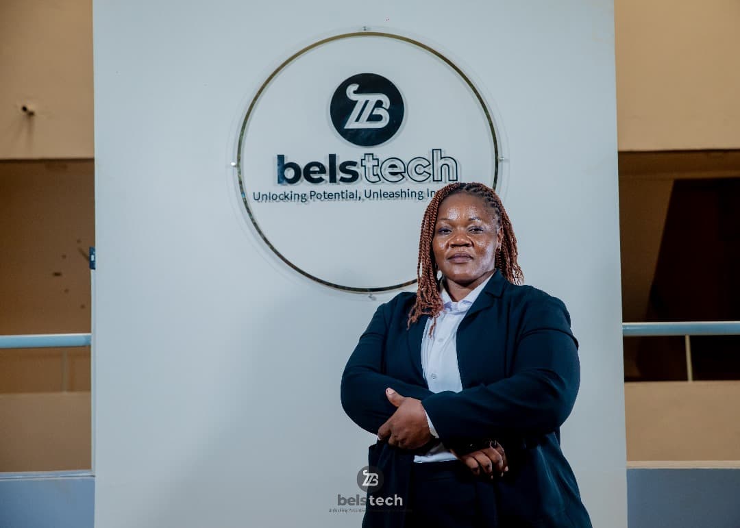 Belstech representative standing in front of the company sign