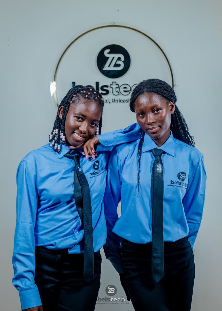 Two Belstech college students in blue uniforms