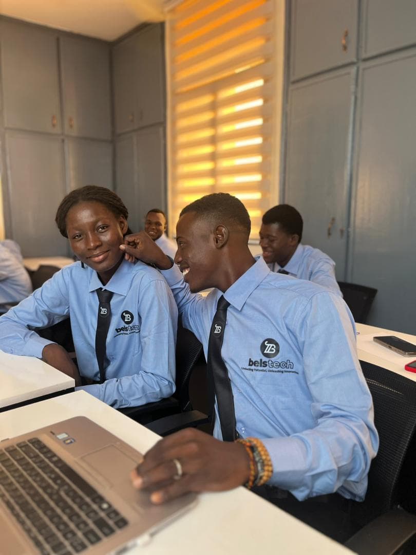 Belstech students learning together around a laptop