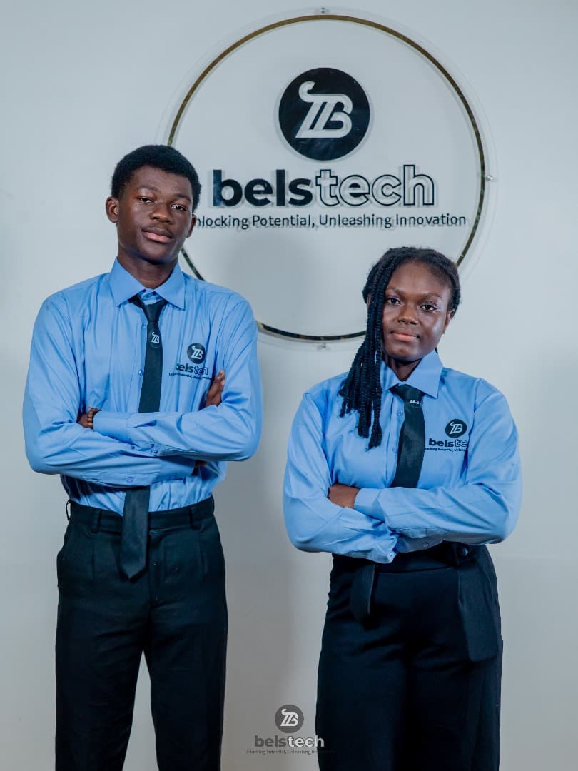 Two Belstech school students in blue uniforms