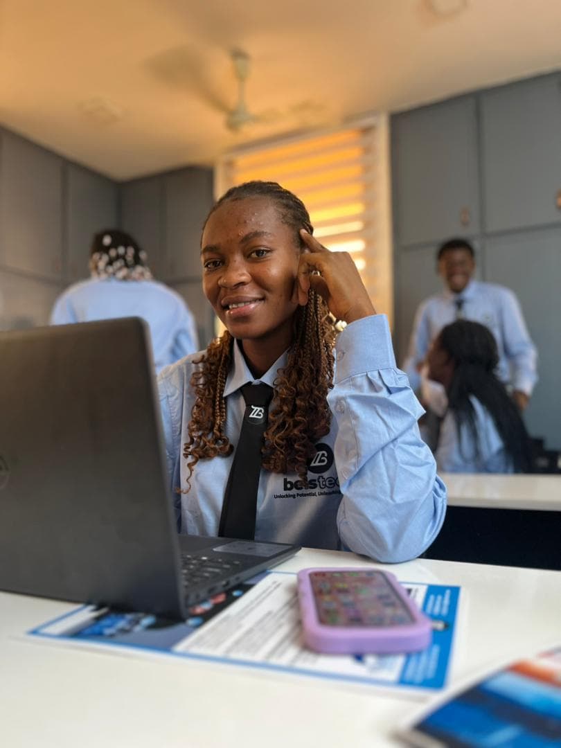 Belstech student working on a laptop in a classroom